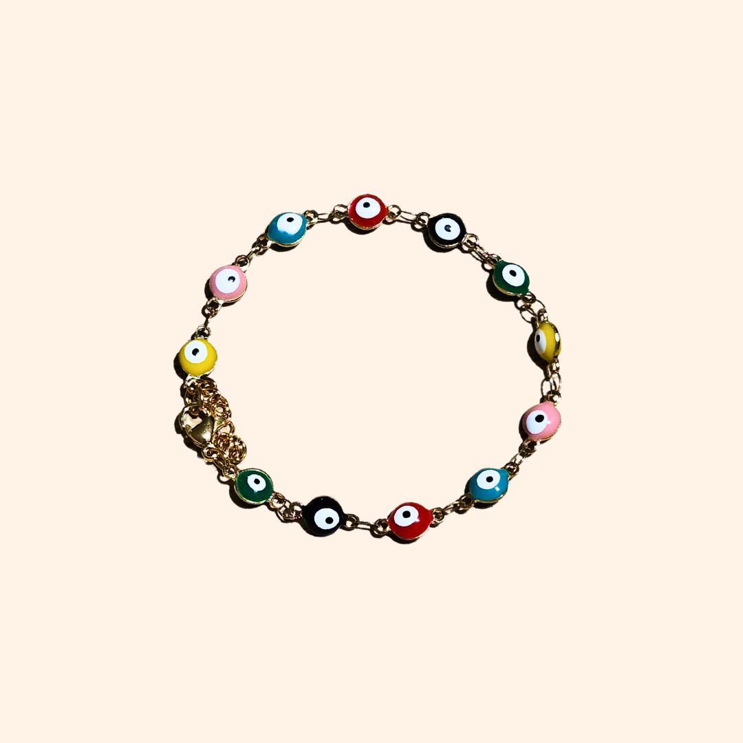 The Evil Eye Bracelet - Rainbow by Roots Jewellery features a gold chain adorned with eye-shaped beads in pink, black, yellow, and green, offering both protection and style.