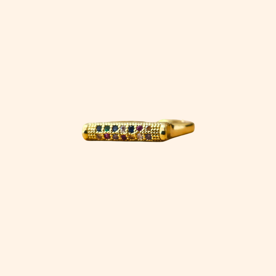 Introducing the Rainbow Signet Gold Ring by Roots Jewellery: an open-ended gold ring with a rectangular top adorned with three small rainbow-colored zircons, ideal for the fashion-forward individual.