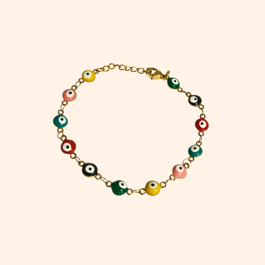 The Evil Eye Bracelet - Rainbow by Roots Jewellery features a gold chain adorned with eye-shaped beads in pink, black, yellow, and green, offering both protection and style.