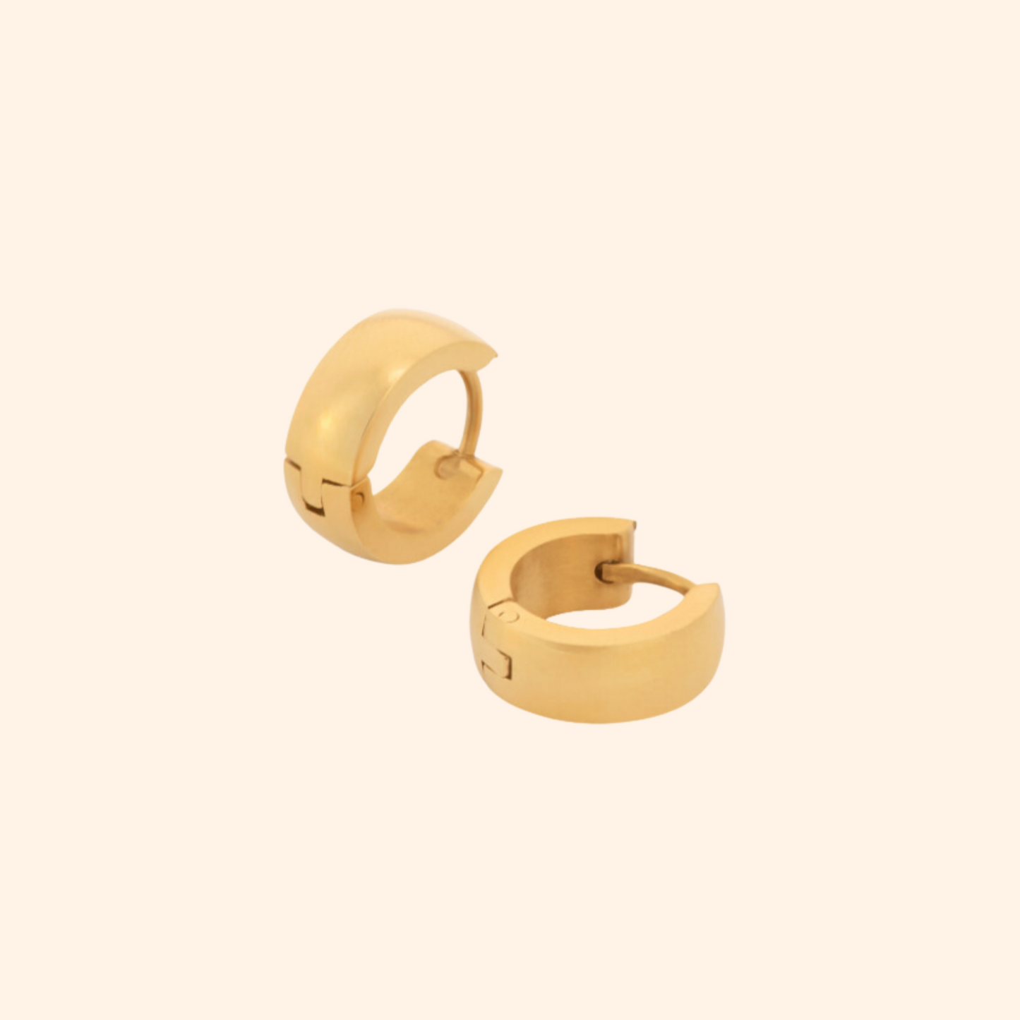 Two elegant pairs of lightweight Classic Clickers gold hoop earrings from Roots Jewellery rest against a plain, light background.