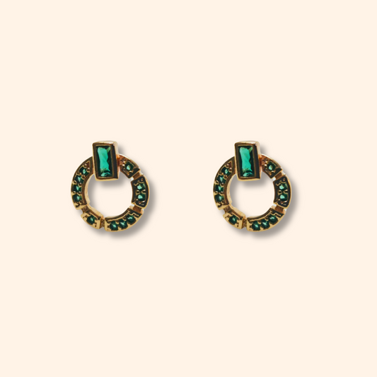 These elegant Natural Green Zircon Earrings by Roots Jewellery feature a gold-plated finish, highlighted by a distinctive circular design adorned with a striking rectangular green zircon stone at the top.