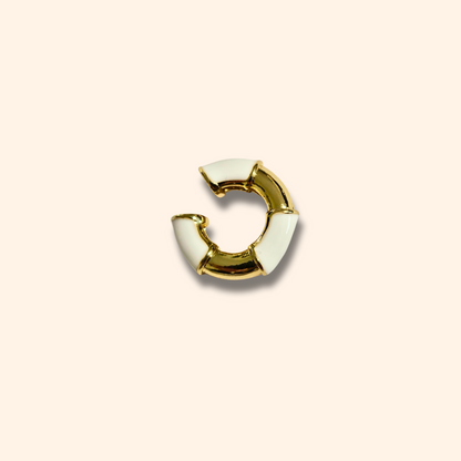 Introducing the Gold Ear Cuff with Colours by Roots Jewellery, this exquisite piece combines the elegance of gold with vibrant hues, elegantly set against a beige background. Crafted to perfection, it embodies sophistication and timeless charm.