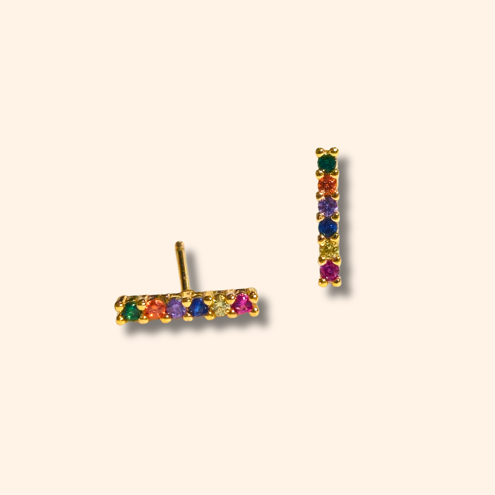 Roots Jewellery's Multicolour line shape earrings, featuring gemstones and cubic zirconia, are elegantly displayed on a light background.