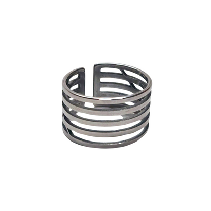 A Circle Ring from Roots Jewellery, featuring a silver color with multiple horizontal cutouts and an open back design, set against a neutral background.