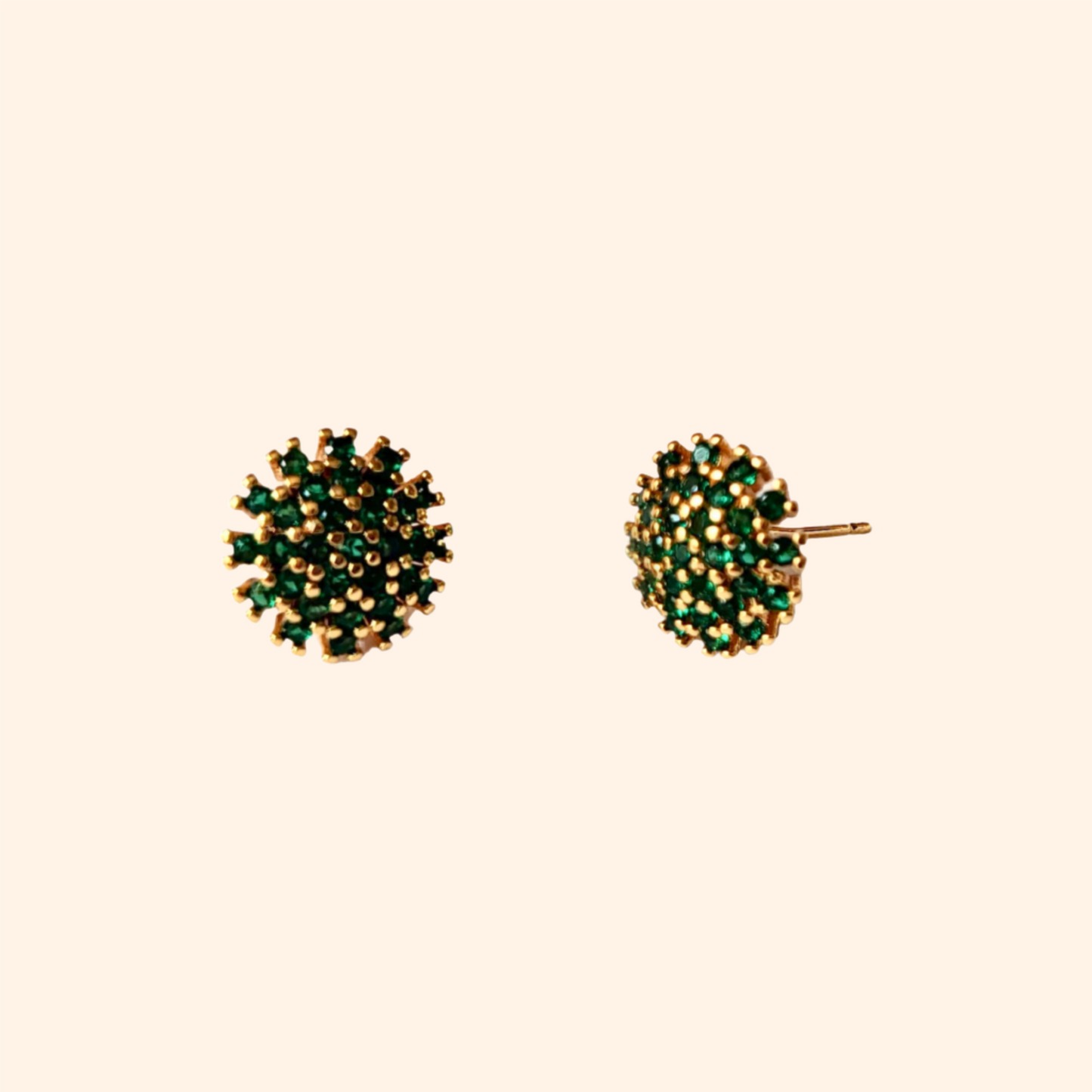 A pair of *Gold & Green Earrings* by Roots Jewellery, featuring a round and bold design with densely set small green stones, displayed against a light background.