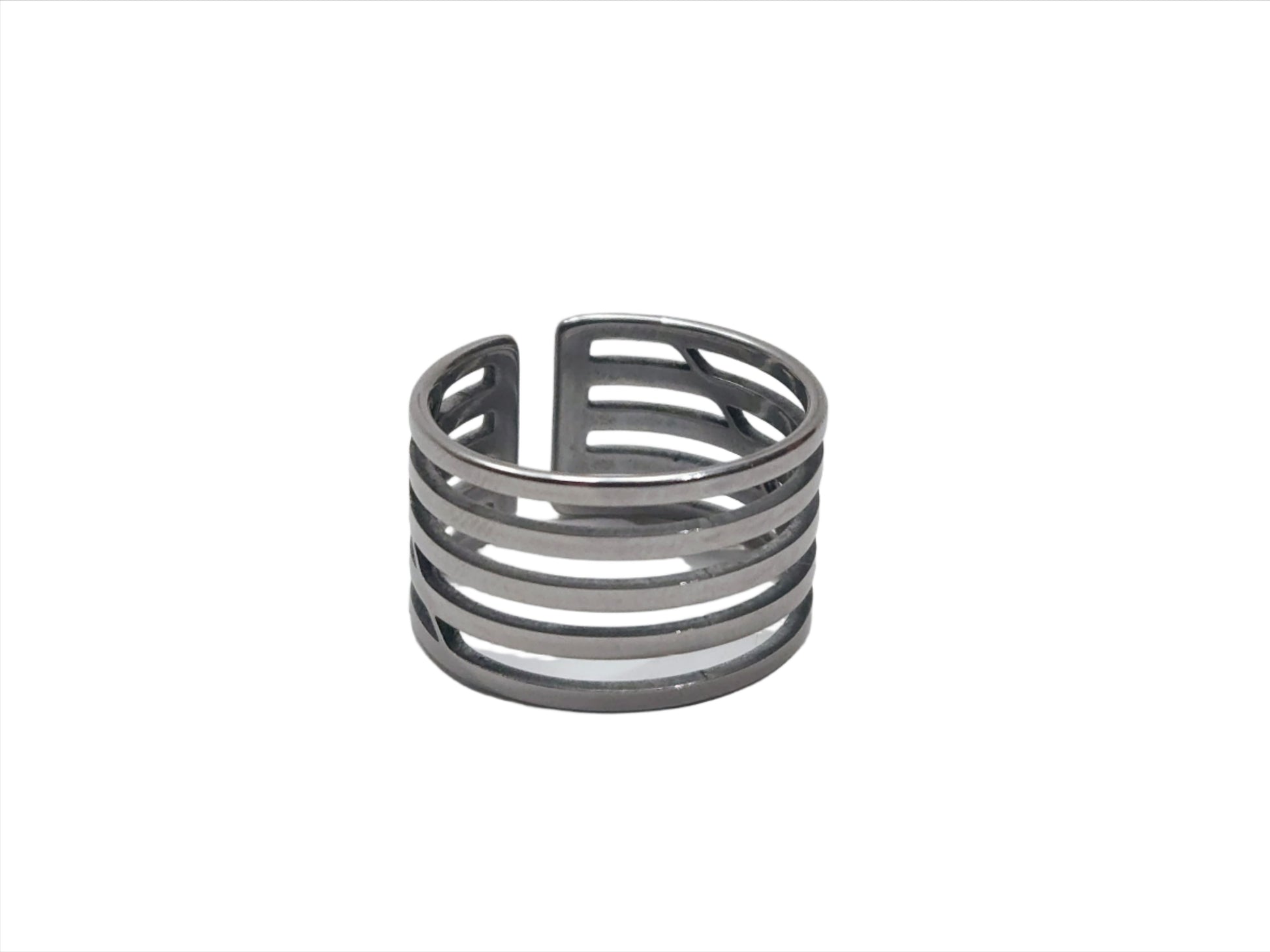 A Circle Ring from Roots Jewellery, featuring a silver color with multiple horizontal cutouts and an open back design, set against a neutral background.